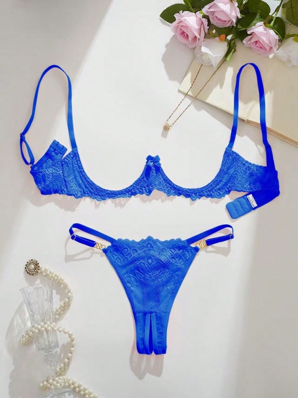 Women's lace bra and panty set with underwire bra, adjustable straps, 3/4 cup design, and matching thong panty in a sheer 2-piece lingerie style.