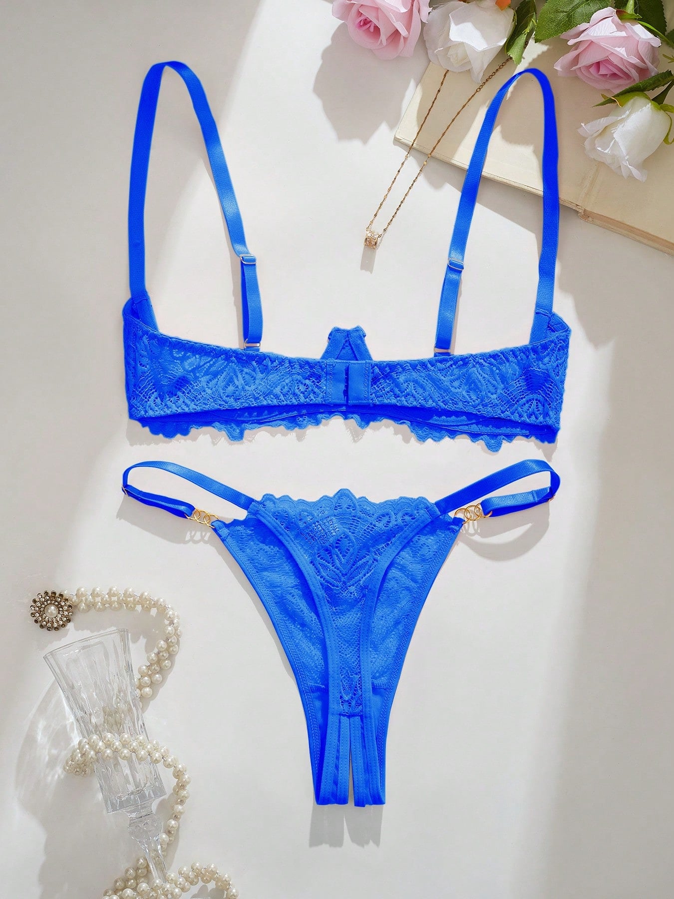 Women's lace bra and panty set with underwire bra, adjustable straps, 3/4 cup design, and matching thong panty in a sheer 2-piece lingerie style.