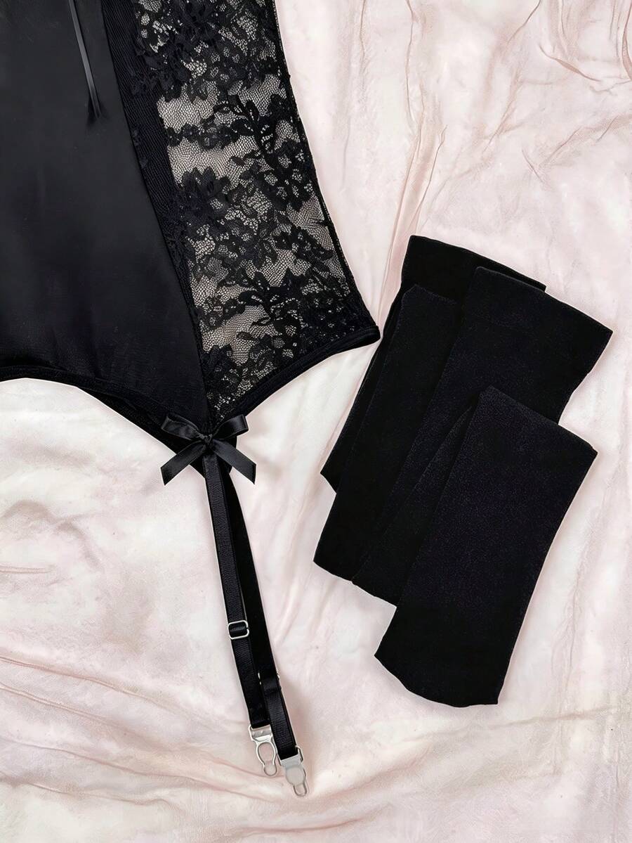 Women's 3-piece sheer black lace nightgown lingerie set featuring a short slip dress with adjustable spaghetti straps, underwire cups, contrast lace patchwork, cut-out details, and a matching low-rise V-string panty.