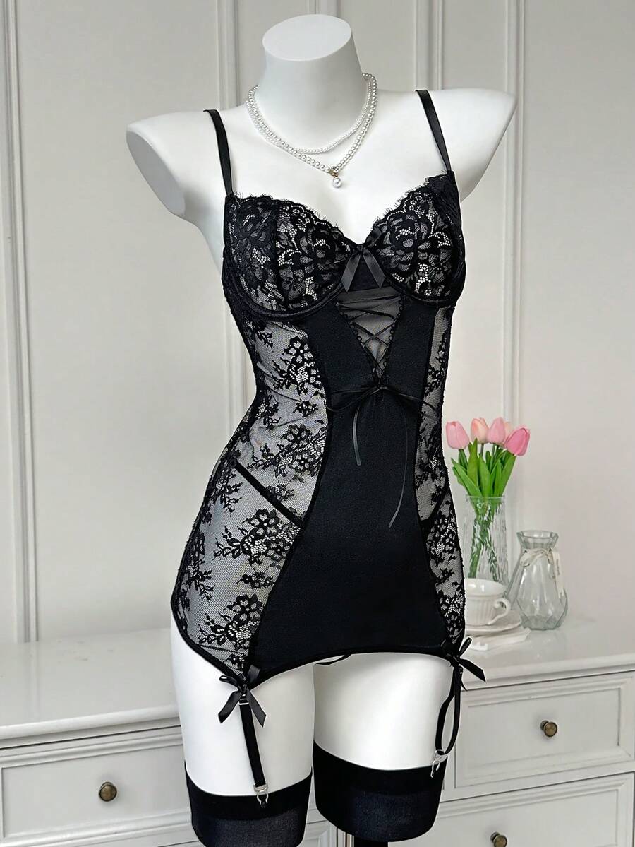 Women's 3-piece sheer black lace nightgown lingerie set featuring a short slip dress with adjustable spaghetti straps, underwire cups, contrast lace patchwork, cut-out details, and a matching low-rise V-string panty.
