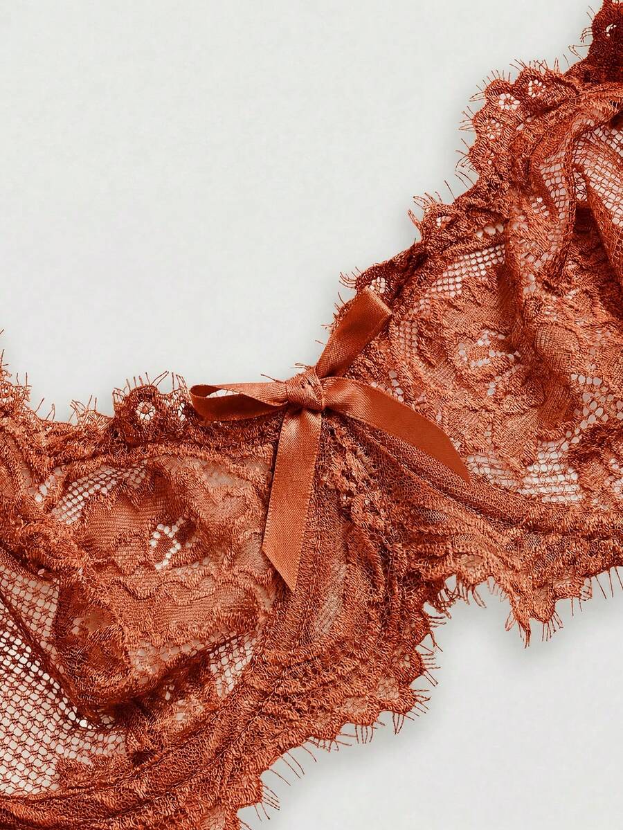 Black sheer floral lace plunge bra featuring underwire support, unlined triangle cups, adjustable straps, and a backless design for women.