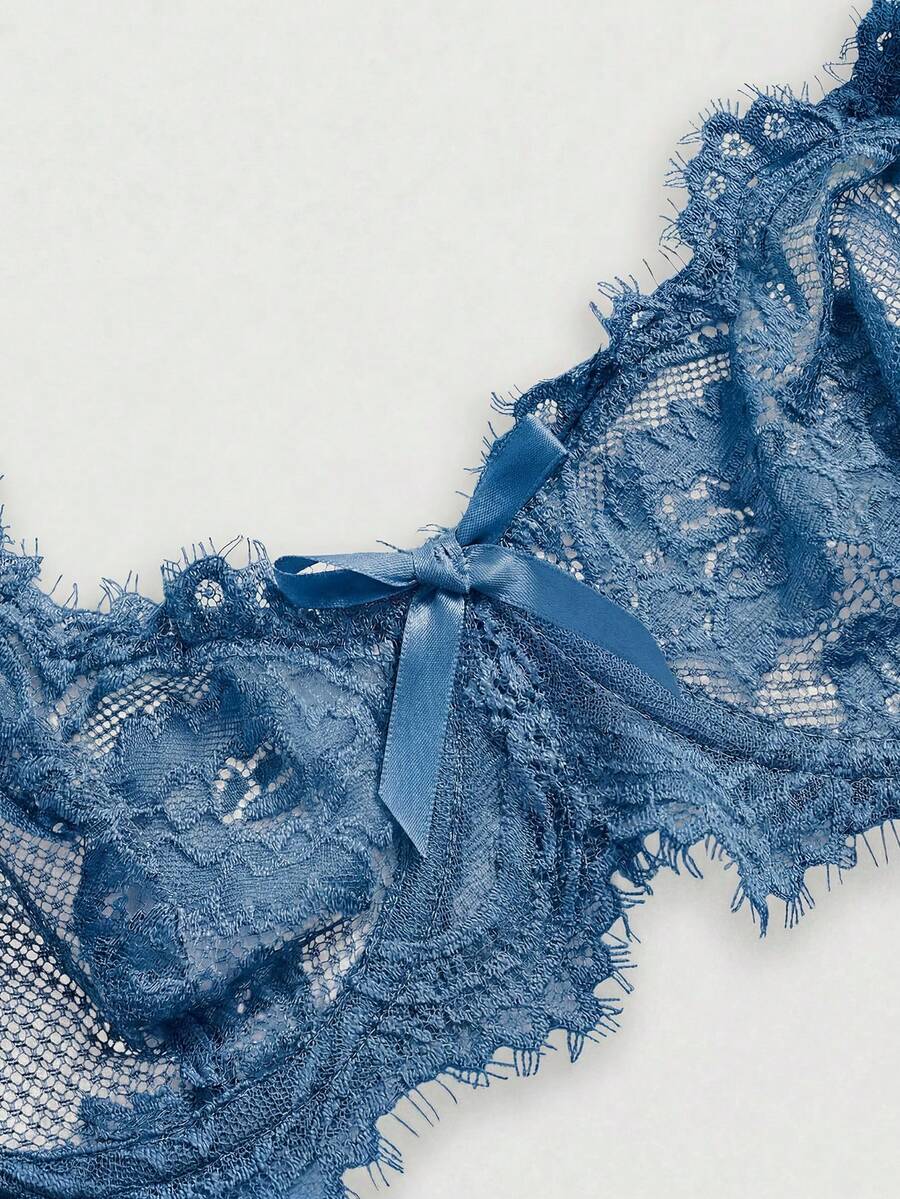Black sheer floral lace plunge bra featuring underwire support, unlined triangle cups, adjustable straps, and a backless design for women.