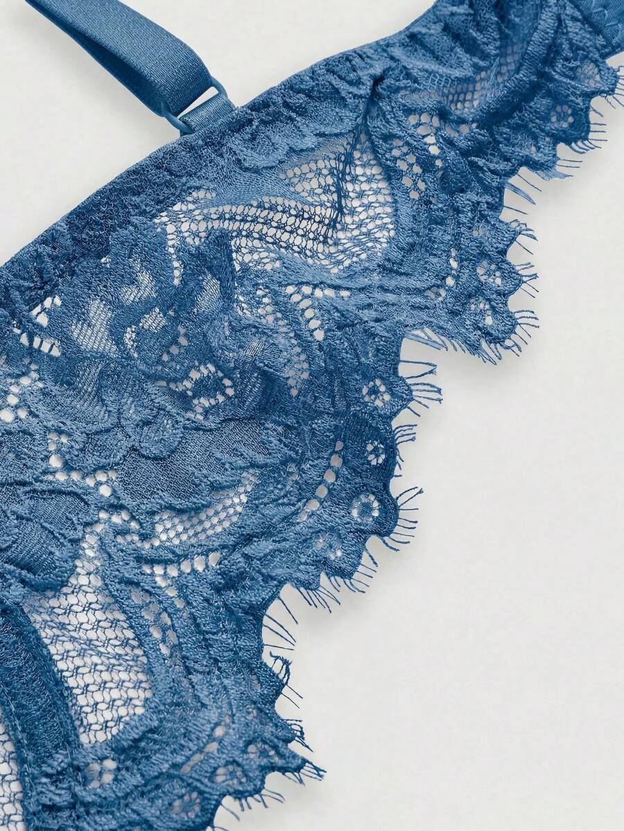 Black sheer floral lace plunge bra featuring underwire support, unlined triangle cups, adjustable straps, and a backless design for women.