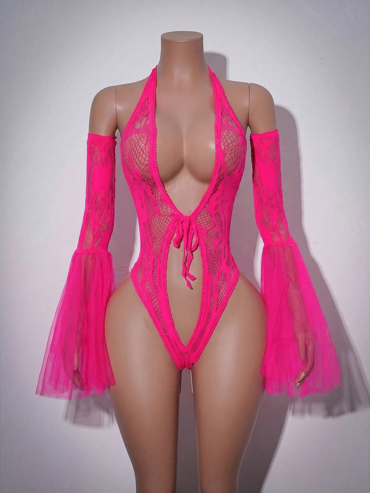 Women wearing a black Y2K 2-piece mesh splice teddy bodysuit featuring a deep plunge neck, long flared sleeves, and ruffle hem detail.