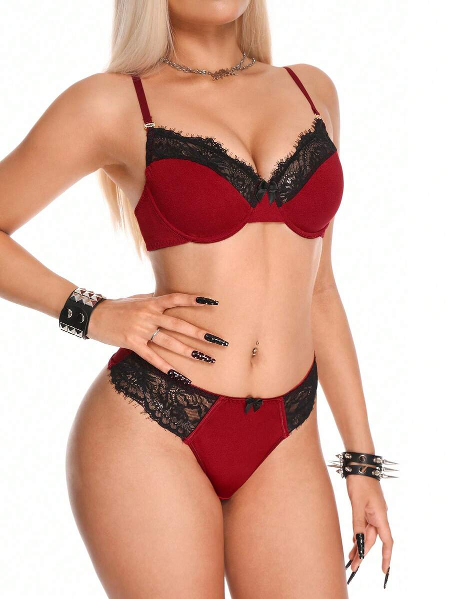 Burgundy lace trim lingerie set for women featuring a goth backless underwire bra with bow decor and adjustable straps paired with a low rise matching thong panty.