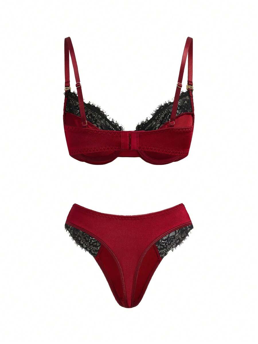 Burgundy lace trim lingerie set for women featuring a goth backless underwire bra with bow decor and adjustable straps paired with a low rise matching thong panty.