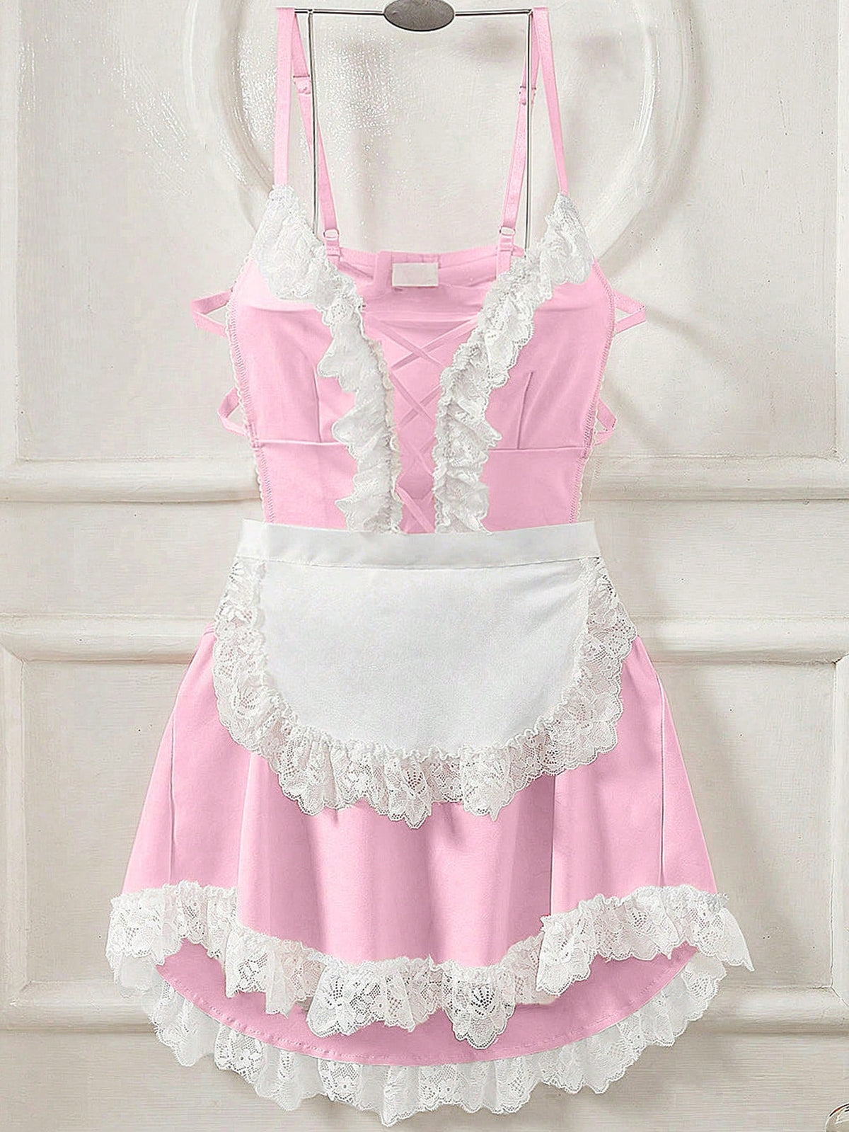 Black 2-piece sexy maid cosplay costume set for women, featuring a spaghetti strap jumpsuit with lace-up criss-cross details and a matching apron.
