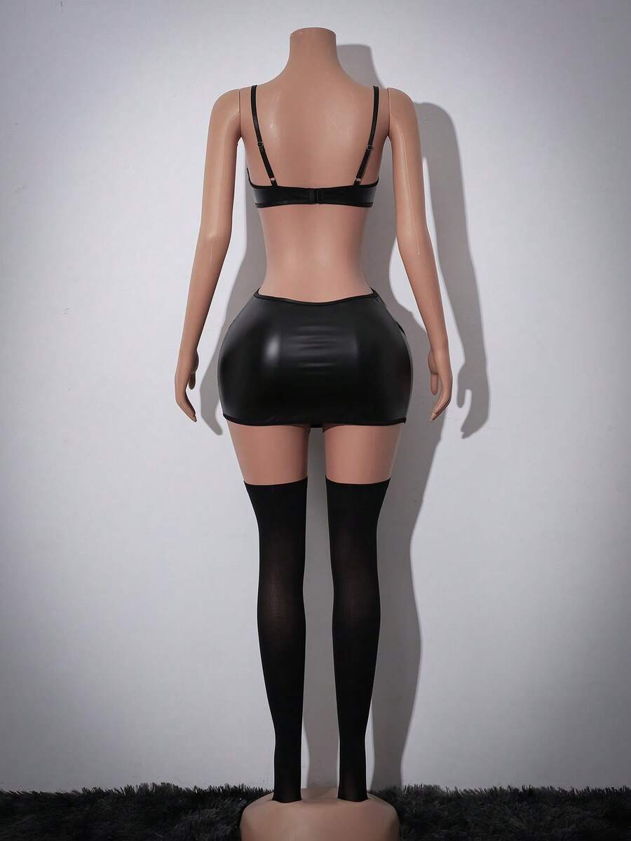 Black 4-piece mesh and PU leather goth lingerie set for women featuring underwire cup detail, backless design, adjustable spaghetti straps, short skirt, and thong.