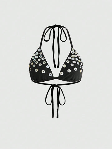 Women's black knitted halter micro crop top featuring studded details, high stretch fabric, and an asymmetrical hem.