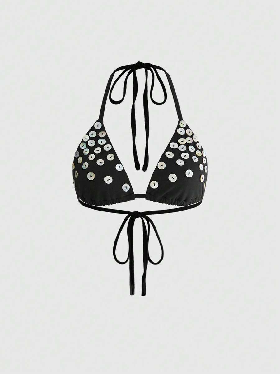 Women's black knitted halter micro crop top featuring studded details, high stretch fabric, and an asymmetrical hem.