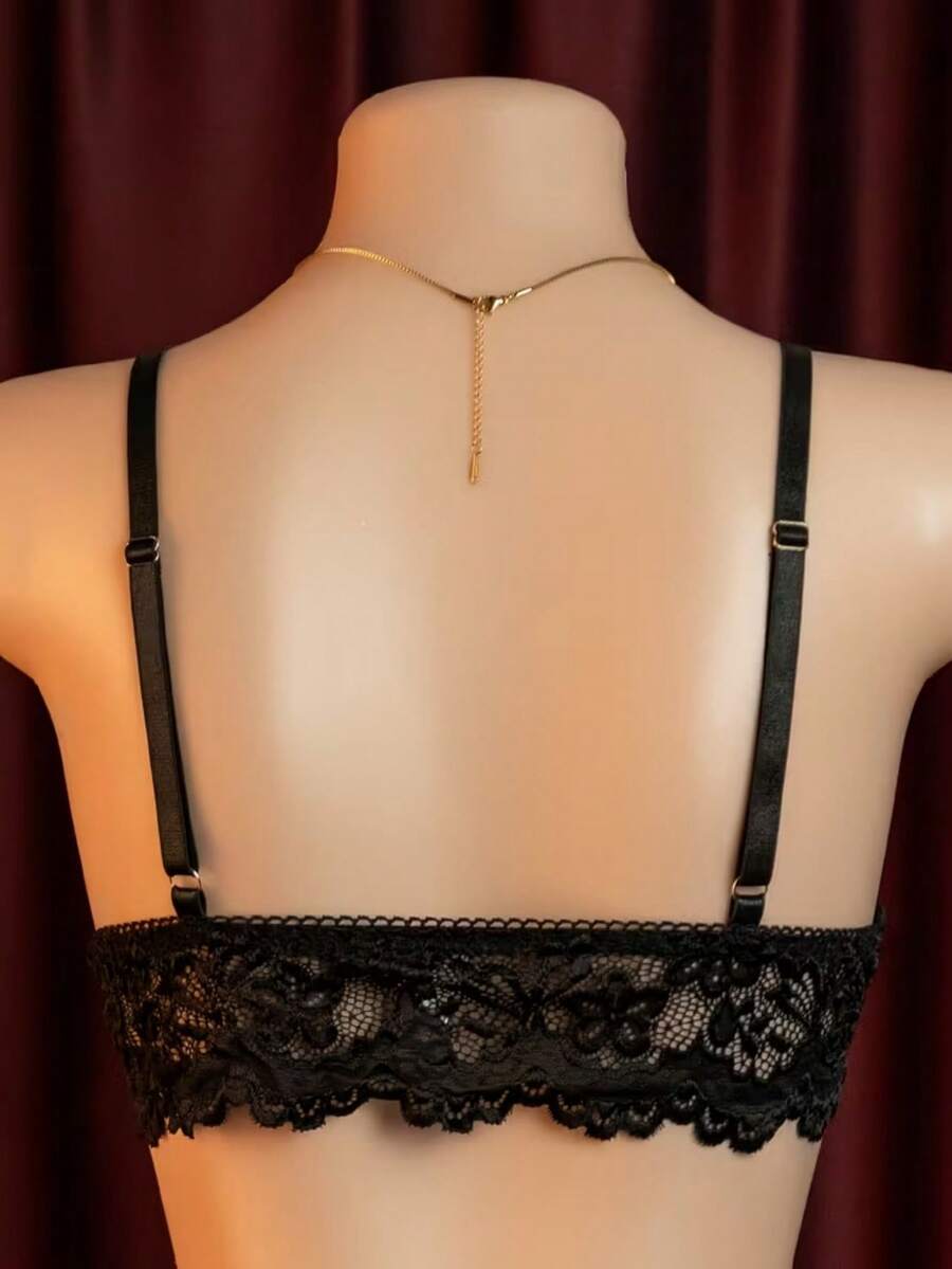 Black 4-piece women's lace bodycon dress lingerie set featuring heart rhinestone spaghetti straps, wireless bralette, thong, and ruffle hem garter.