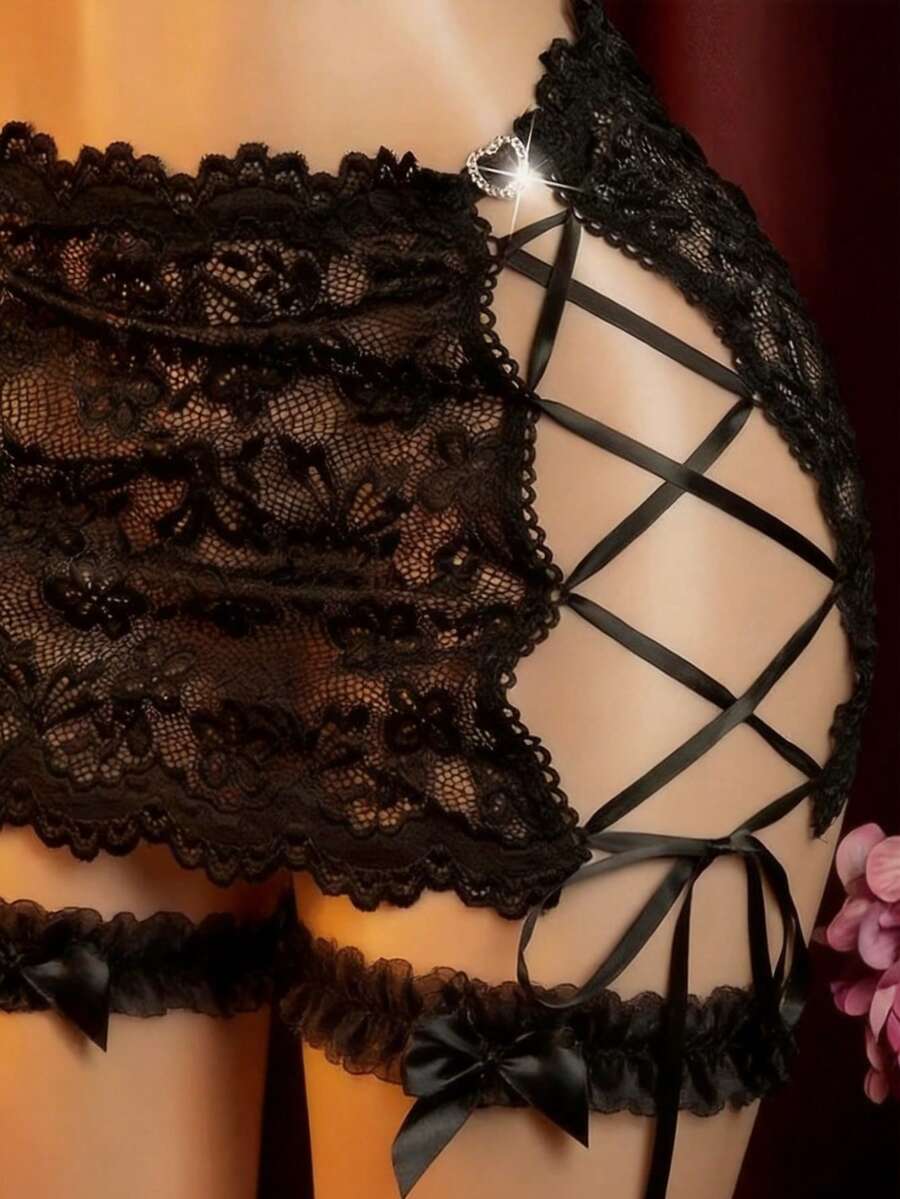 Black 4-piece women's lace bodycon dress lingerie set featuring heart rhinestone spaghetti straps, wireless bralette, thong, and ruffle hem garter.