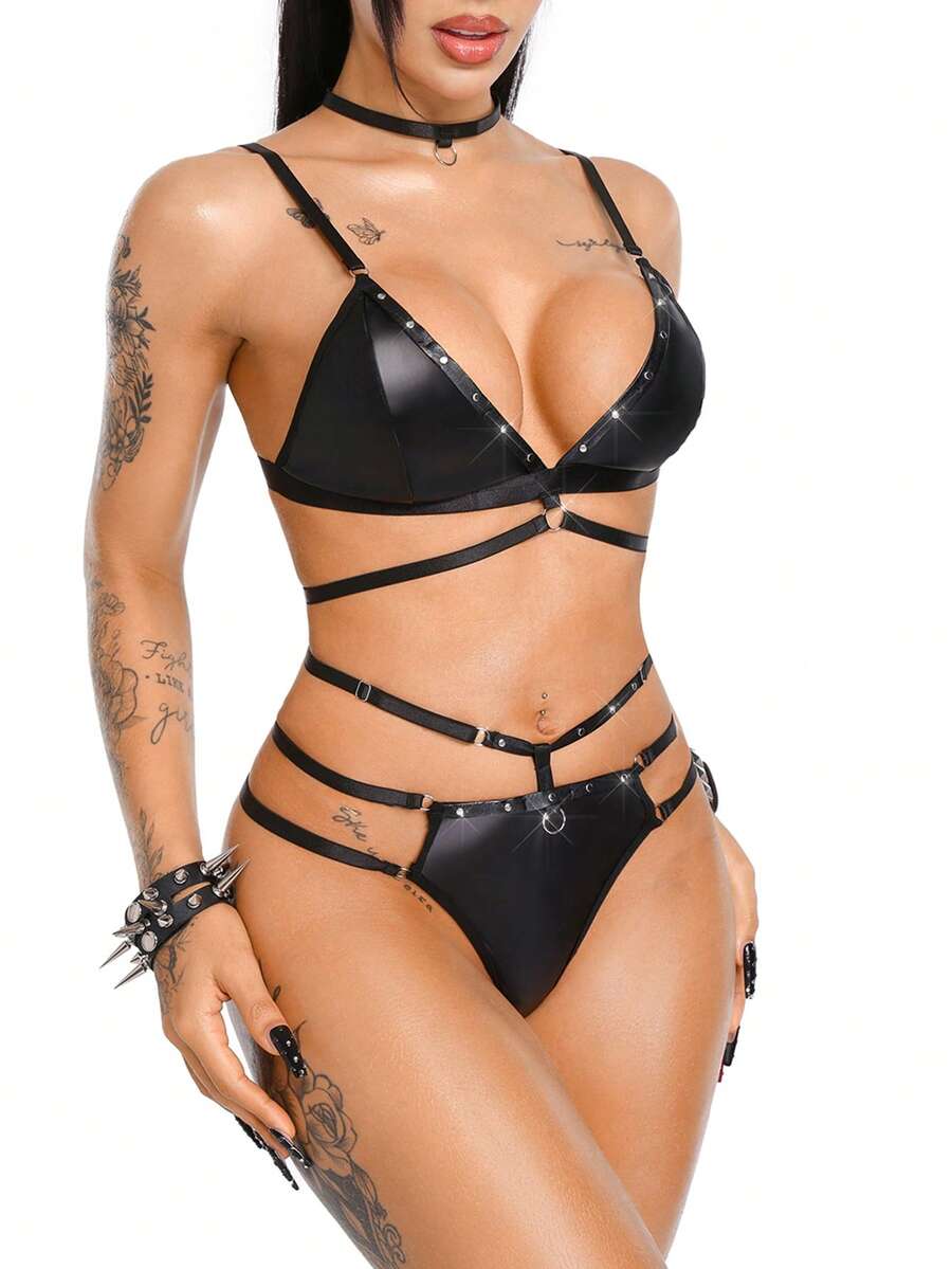 Black 3-piece women's goth lingerie set featuring a rivet lace-up wireless camisole bra, backless design, adjustable straps, and matching mid-rise briefs.