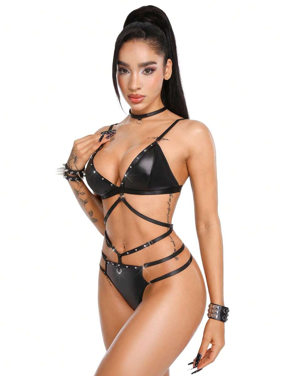 Black 3-piece women's goth lingerie set featuring a rivet lace-up wireless camisole bra, backless design, adjustable straps, and matching mid-rise briefs.
