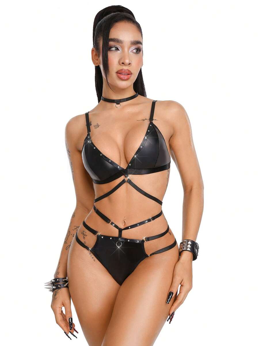 Black 3-piece women's goth lingerie set featuring a rivet lace-up wireless camisole bra, backless design, adjustable straps, and matching mid-rise briefs.