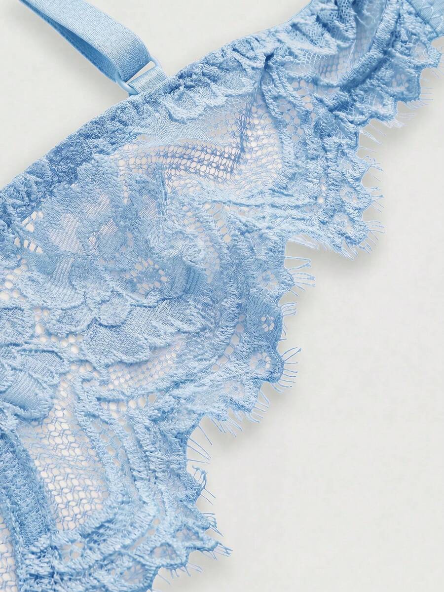 Black sheer floral lace plunge bra featuring underwire support, unlined triangle cups, adjustable straps, and a backless design for women.