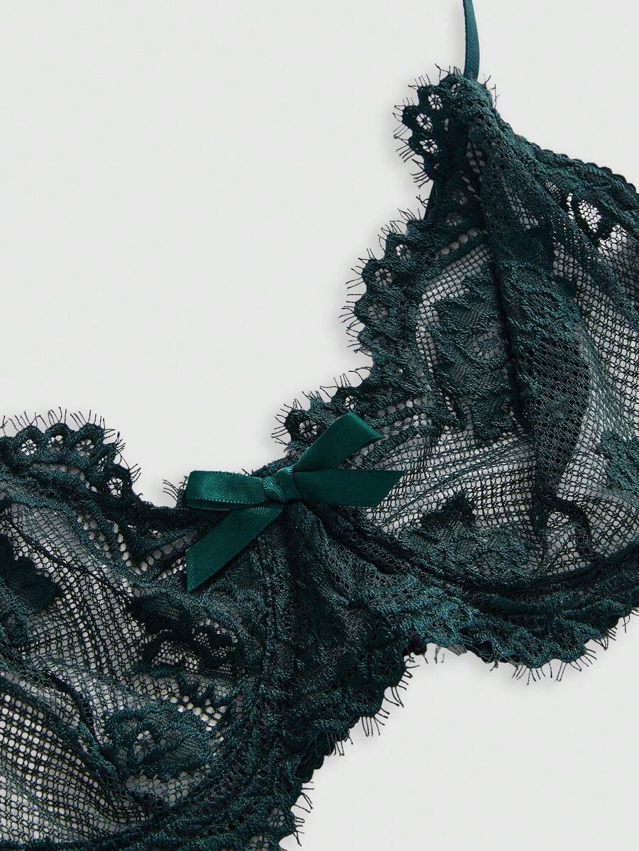 Black sheer floral lace plunge bra featuring underwire support, unlined triangle cups, adjustable straps, and a backless design for women.