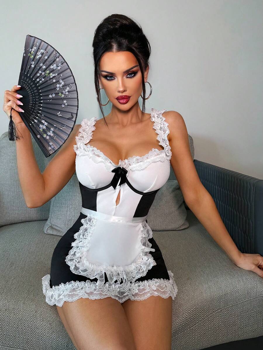 Women's 2-piece black and white lace maid role play cosplay costume set with sweetheart neckline, backless detail, knot accent, underwire support, adjustable straps, and thong.
