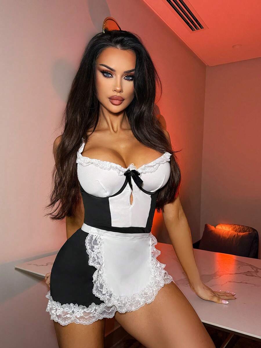 Women's 2-piece black and white lace maid role play cosplay costume set with sweetheart neckline, backless detail, knot accent, underwire support, adjustable straps, and thong.