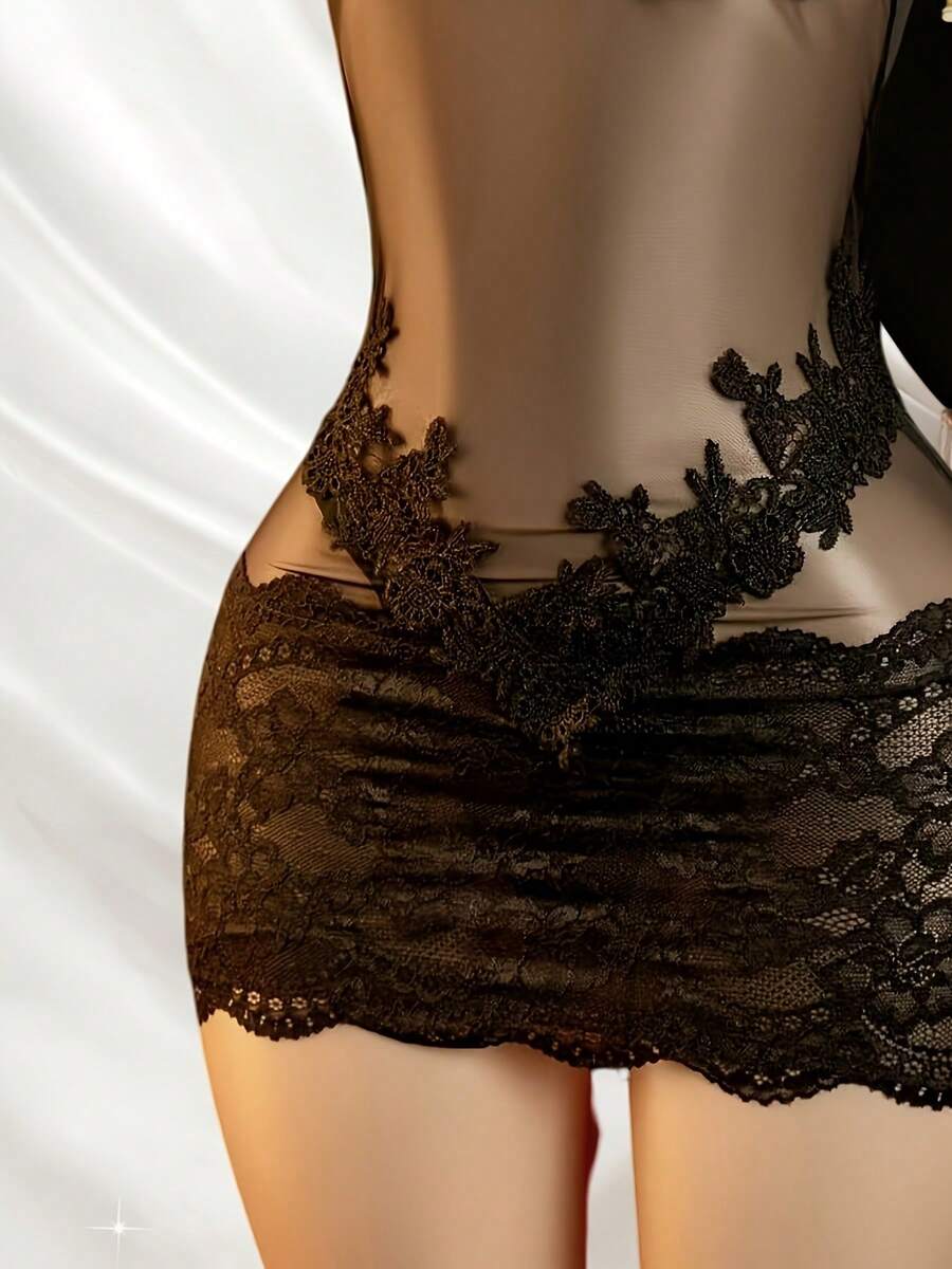 Women's black lace mesh strap lingerie set featuring semi-sheer fabric, button front detail, adjustable straps, and a wireless design.