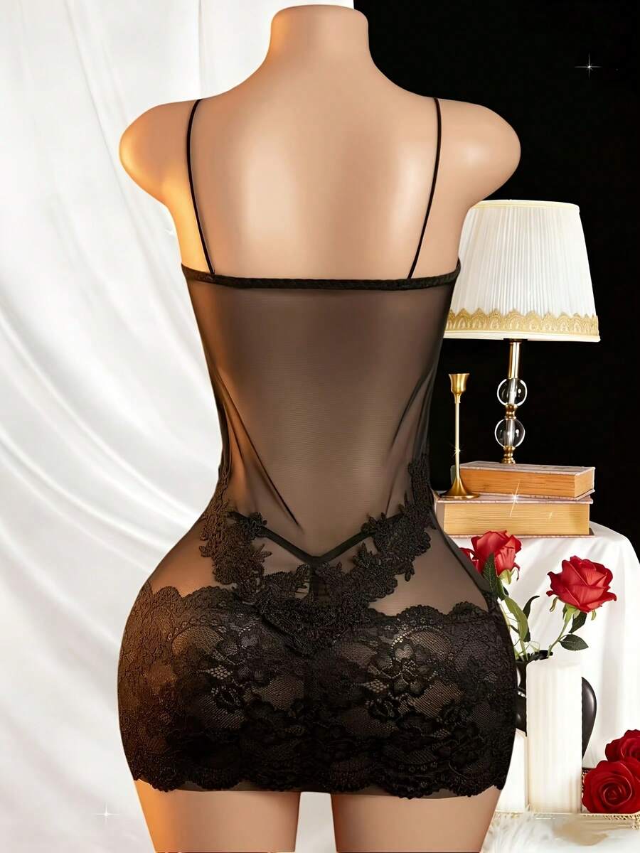 Women's black lace mesh strap lingerie set featuring semi-sheer fabric, button front detail, adjustable straps, and a wireless design.
