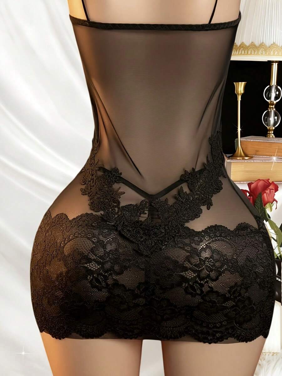 Women's black lace mesh strap lingerie set featuring semi-sheer fabric, button front detail, adjustable straps, and a wireless design.