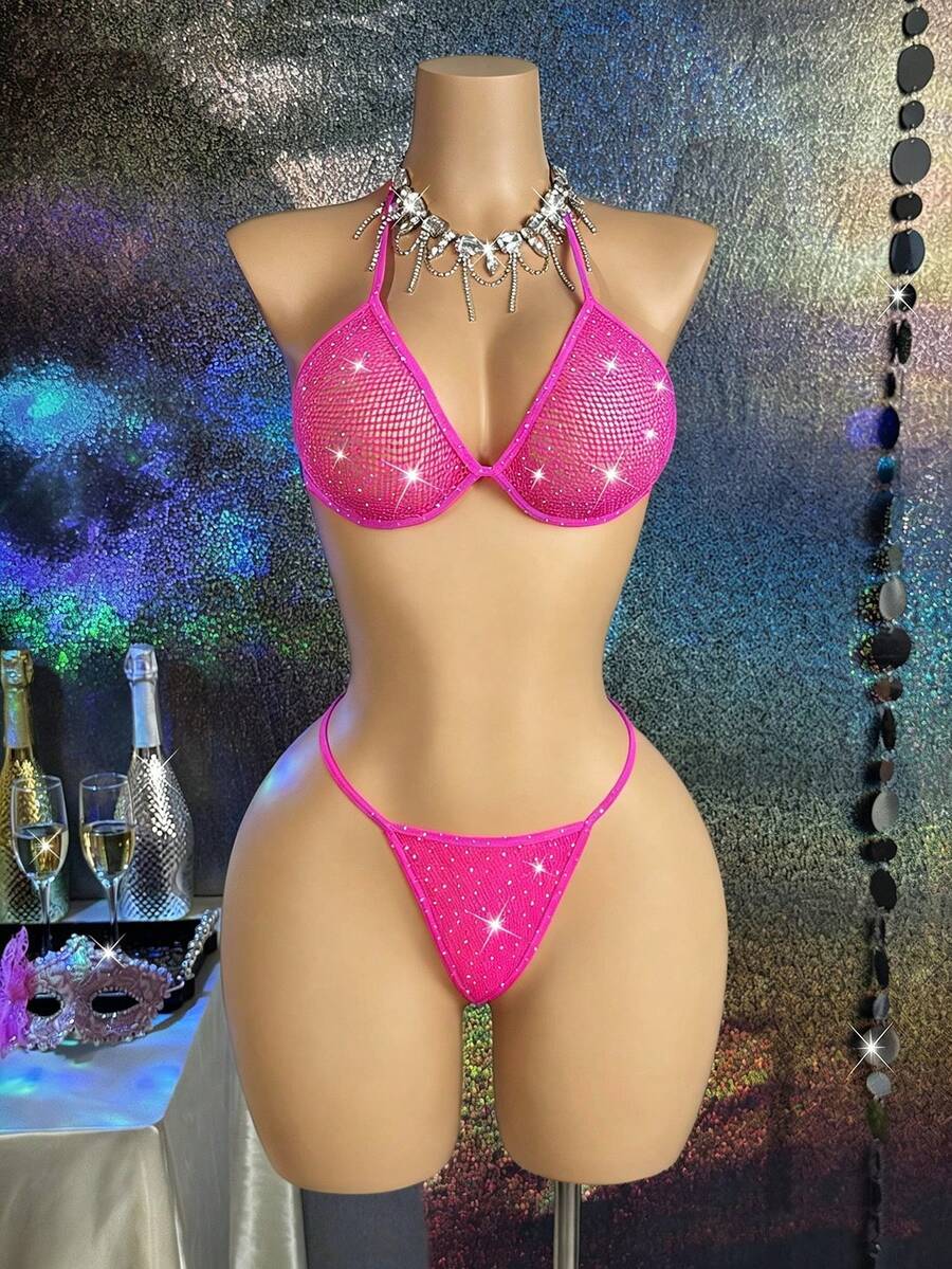 Black lace camisole lingerie set for women featuring a halter neck triangle bra with underwire, backless tie-back detail, and matching low-rise thong.