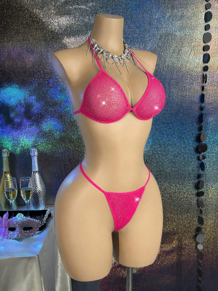 Black lace camisole lingerie set for women featuring a halter neck triangle bra with underwire, backless tie-back detail, and matching low-rise thong.