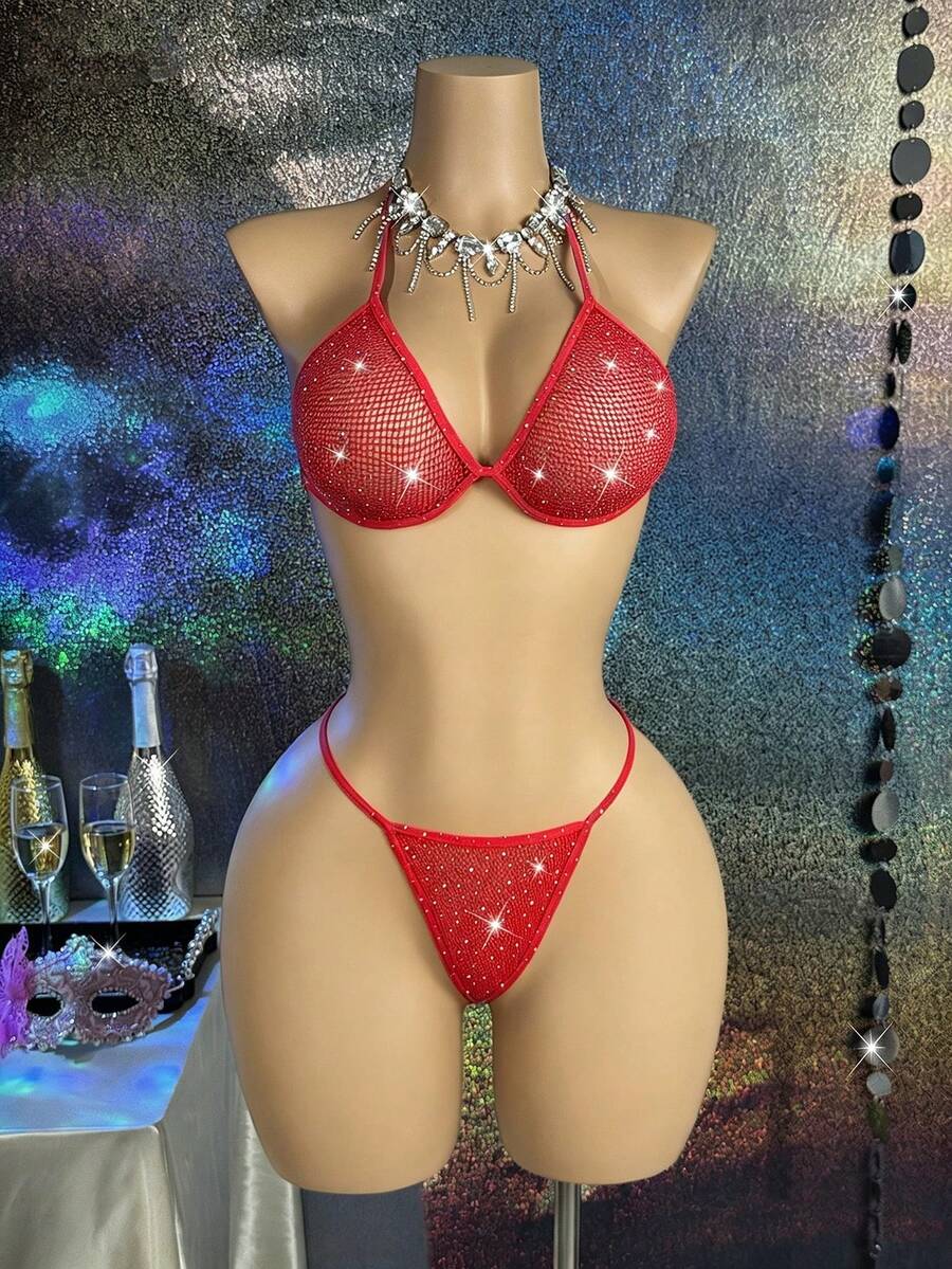 Black lace camisole lingerie set for women featuring a halter neck triangle bra with underwire, backless tie-back detail, and matching low-rise thong.