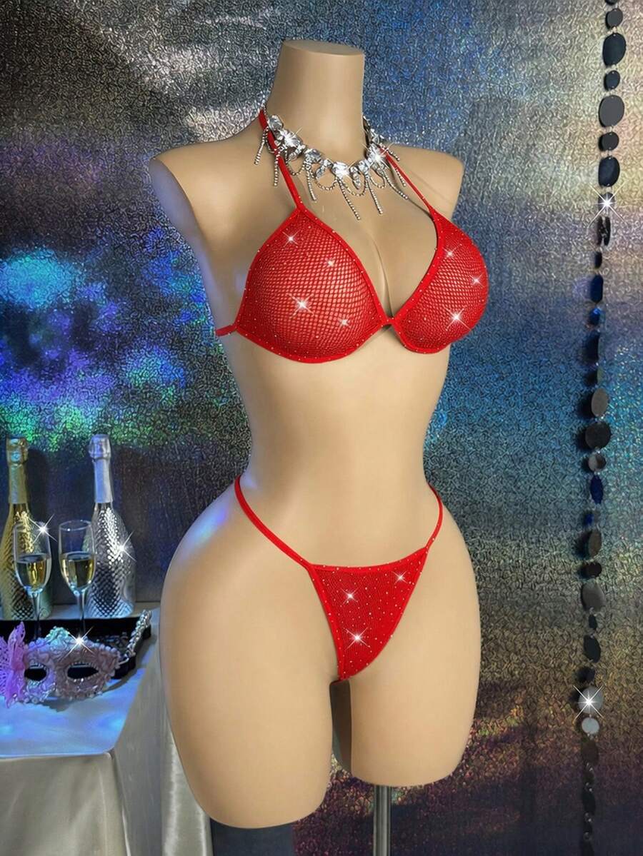 Black lace camisole lingerie set for women featuring a halter neck triangle bra with underwire, backless tie-back detail, and matching low-rise thong.