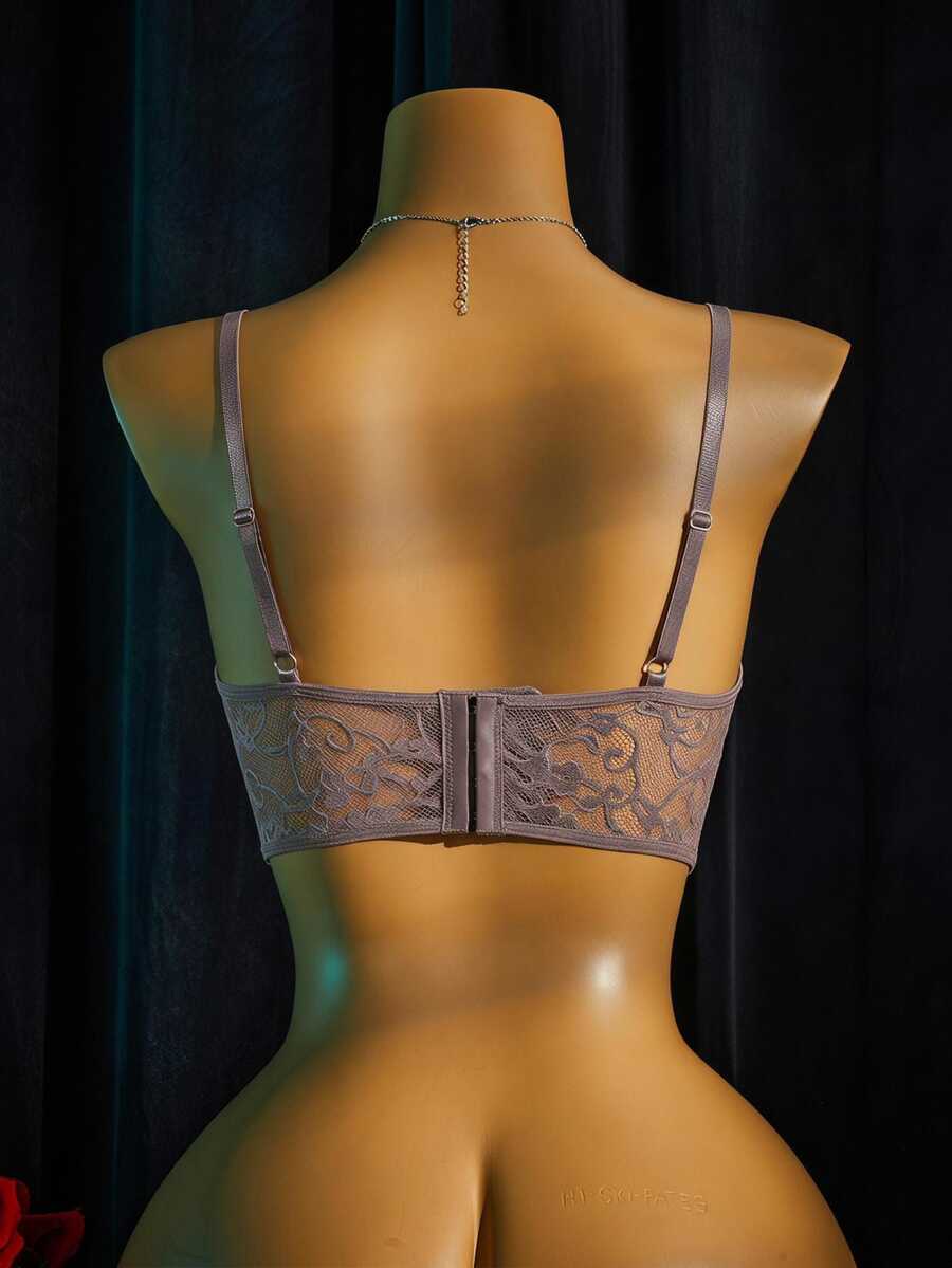 Women's sheer lace bralette lingerie set featuring a longline spaghetti strap bra top and matching mid-rise thong panty.