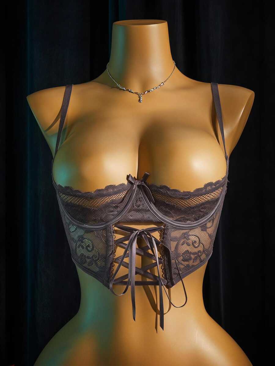 Women's sheer lace bralette lingerie set featuring a longline spaghetti strap bra top and matching mid-rise thong panty.