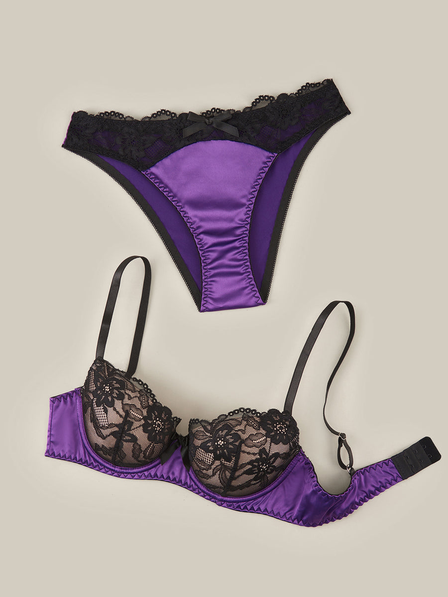 Purple 2-piece satin lingerie set featuring a push-up underwire bra with contrast lace trim, bow detail, adjustable shoulder straps, and matching low-rise briefs.