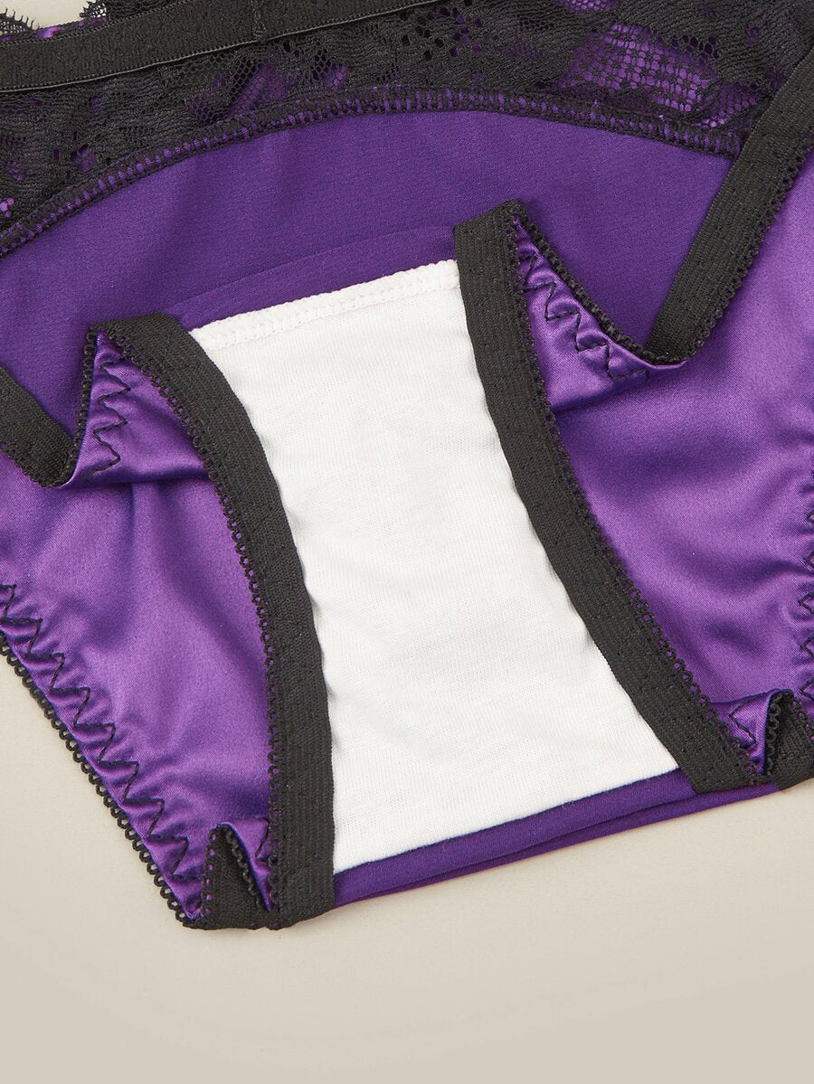 Purple 2-piece satin lingerie set featuring a push-up underwire bra with contrast lace trim, bow detail, adjustable shoulder straps, and matching low-rise briefs.