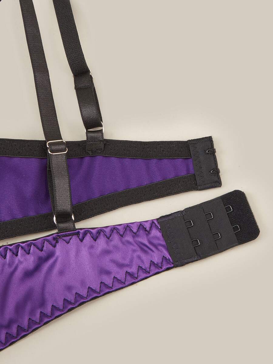 Purple 2-piece satin lingerie set featuring a push-up underwire bra with contrast lace trim, bow detail, adjustable shoulder straps, and matching low-rise briefs.