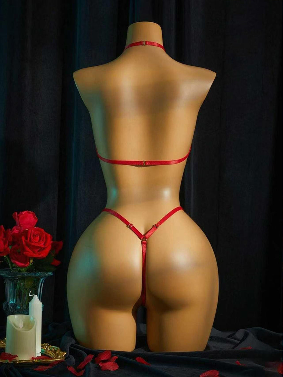 Women's halter neck faux leather bodysuit lingerie featuring a backless design, knot details, and adjustable straps.