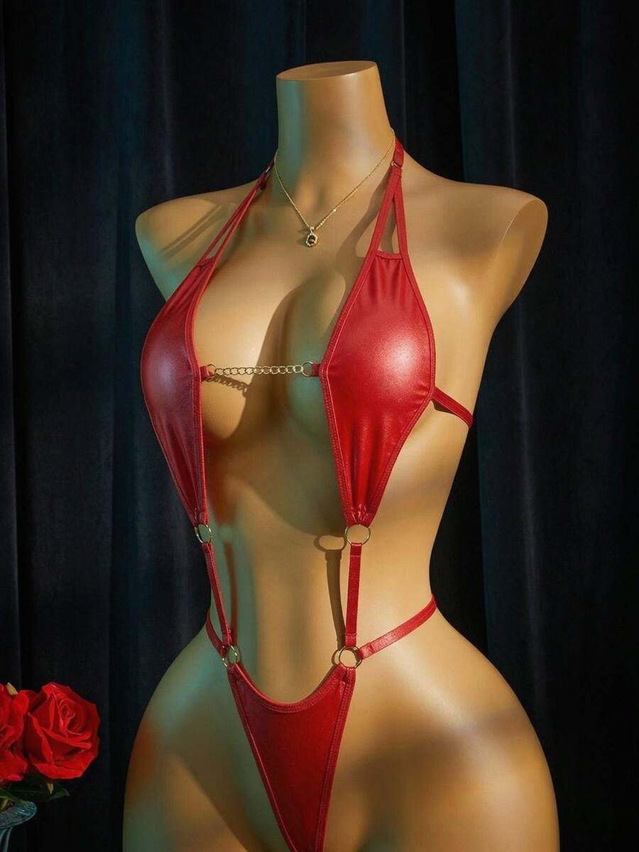 Women's halter neck faux leather bodysuit lingerie featuring a backless design, knot details, and adjustable straps.
