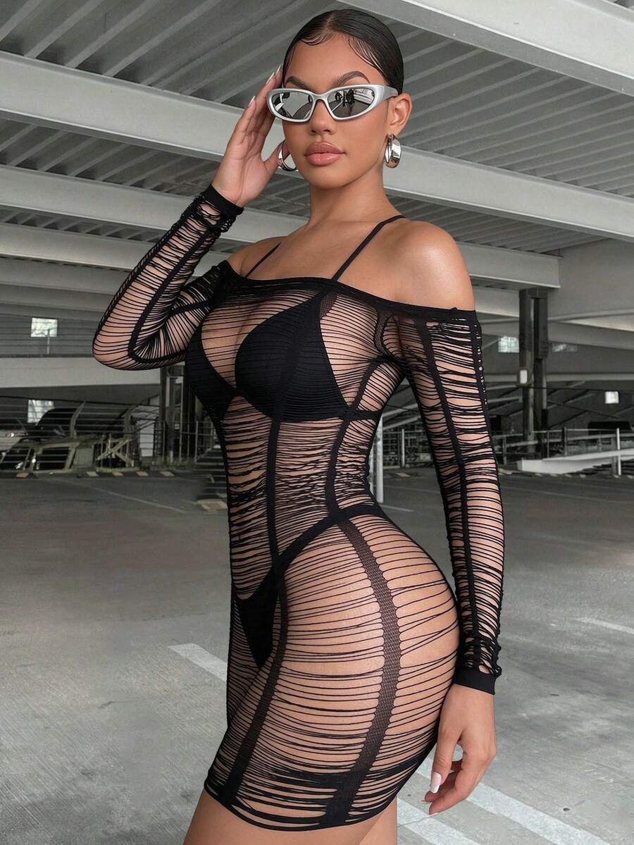 Women's black long sleeve fishnet cover-up mini dress featuring a hollow out sheer bodycon design