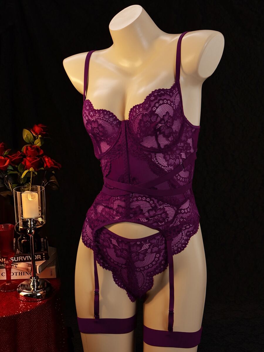 3-piece black lace lingerie set featuring a longline underwire 1/2 cup bra with adjustable spaghetti straps, cut out details, and matching low-rise thong