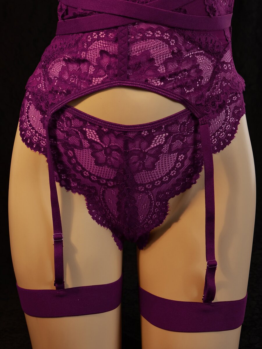 3-piece black lace lingerie set featuring a longline underwire 1/2 cup bra with adjustable spaghetti straps, cut out details, and matching low-rise thong