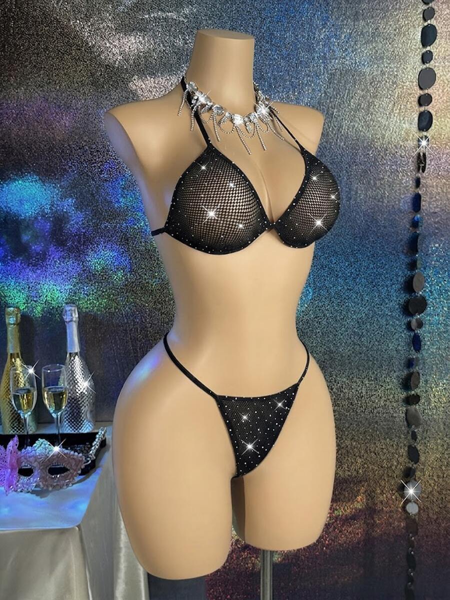 Black lace camisole lingerie set for women featuring a halter neck triangle bra with underwire, backless tie-back detail, and matching low-rise thong.