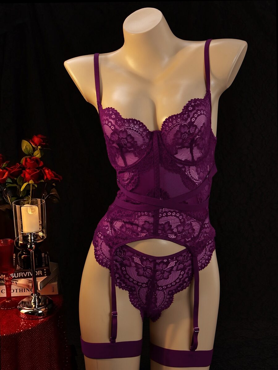 3-piece black lace lingerie set featuring a longline underwire 1/2 cup bra with adjustable spaghetti straps, cut out details, and matching low-rise thong